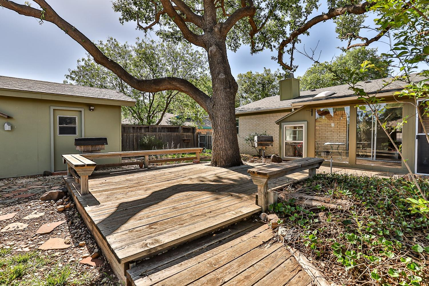 4602 63rd Street Lubbock, TX 79414 - Photo 34 of 37 a view of a house with backyard and sitting area