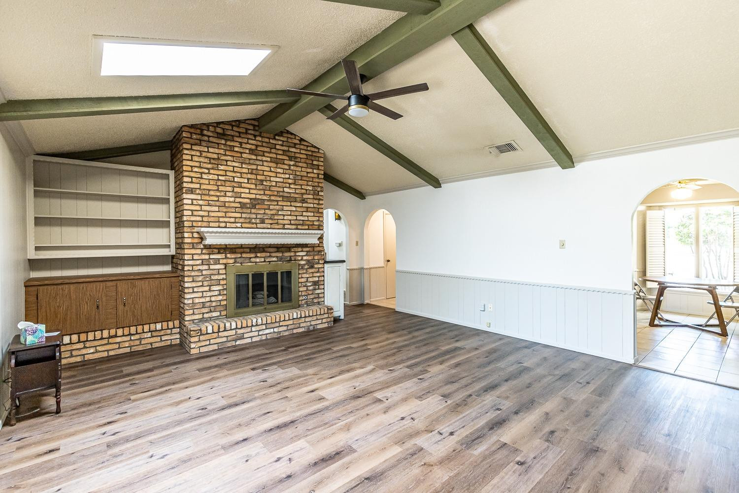 4602 63rd Street Lubbock, TX 79414 - Photo 7 of 37 a view of a livingroom with wooden floor and staircase