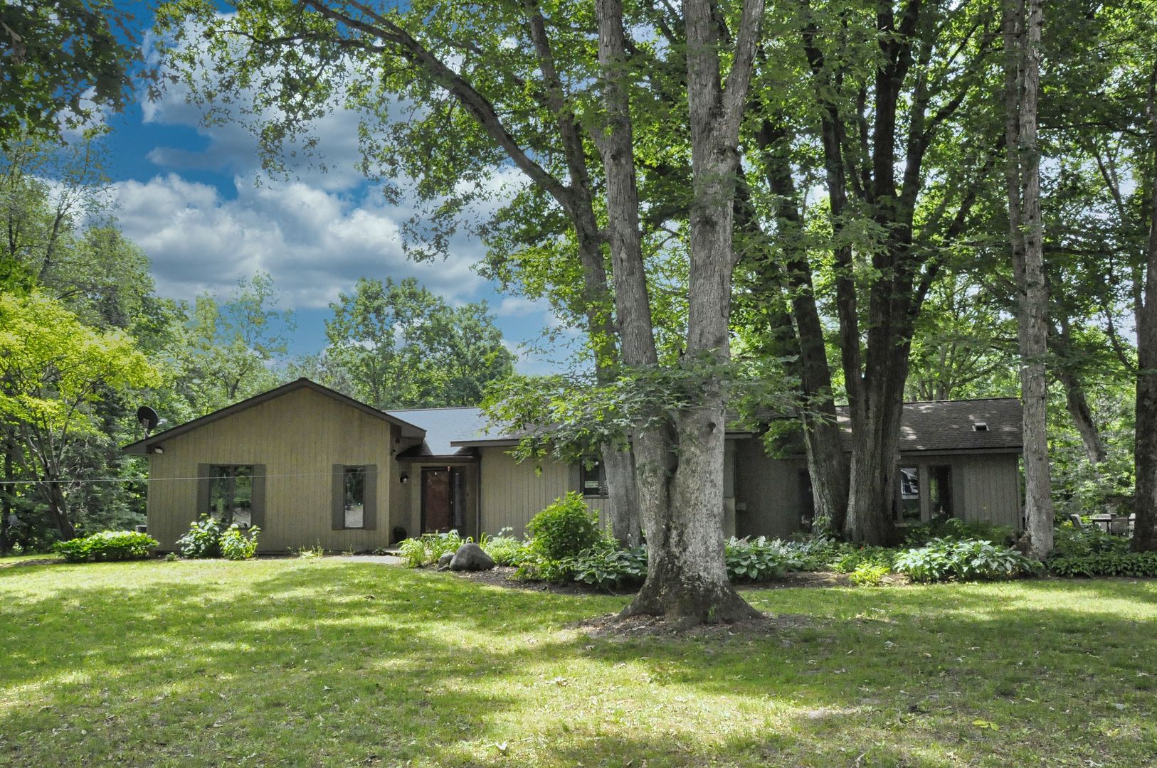 2048 North 3650th Road Serena, IL 60549 - Photo 2 of 82 a front view of a house with a garden and trees