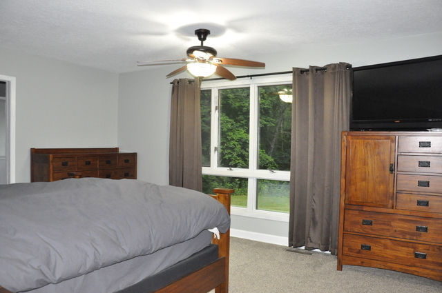 2048 North 3650th Road Serena, IL 60549 - Photo 30 of 82 a bedroom with a bed and a flat tv screen on dresser