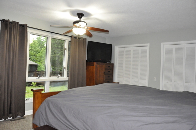 2048 North 3650th Road Serena, IL 60549 - Photo 31 of 82 a bedroom with a large bed and a large window