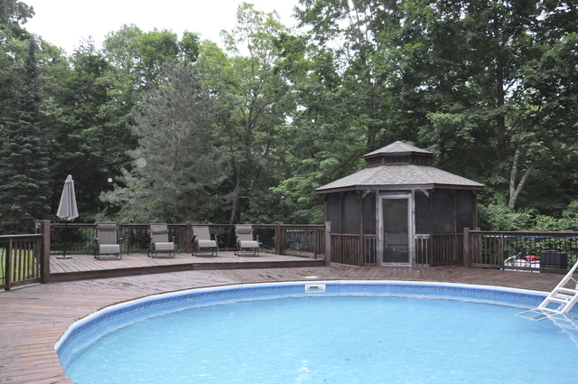 2048 North 3650th Road Serena, IL 60549 - Photo 57 of 82 a view of a house with a swimming pool and sitting area