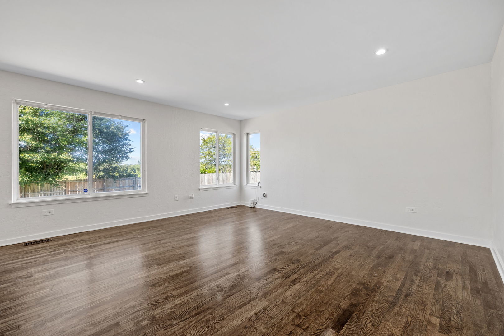 147 Willow Bend Bolingbrook, IL 60490 - Photo 11 of 22 an empty room with wooden floor and windows
