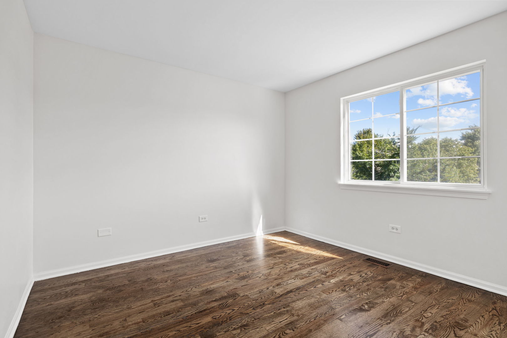 147 Willow Bend Bolingbrook, IL 60490 - Photo 17 of 22 wooden floor in an empty room with a window