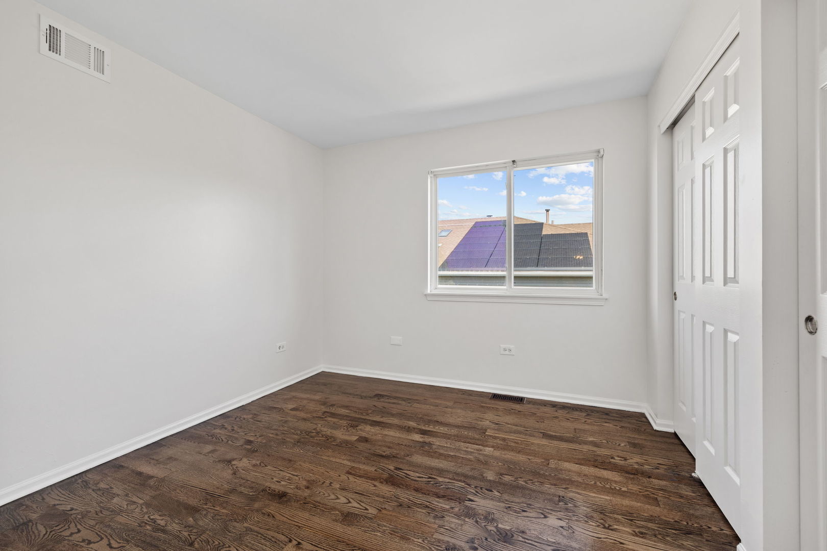 147 Willow Bend Bolingbrook, IL 60490 - Photo 18 of 22 a view of an empty room with wooden floor and a window