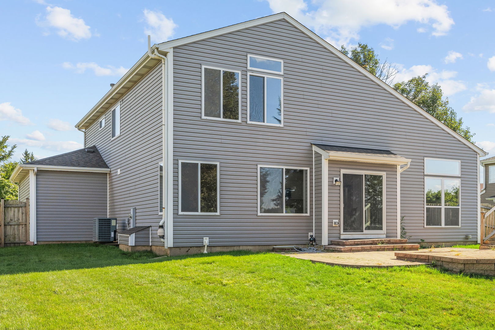147 Willow Bend Bolingbrook, IL 60490 - Photo 22 of 22 a backyard of a house with garden and patio