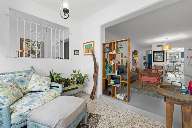 a living room with furniture and a window