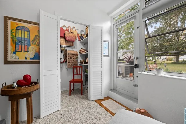 a spacious bedroom with a bed and a couch