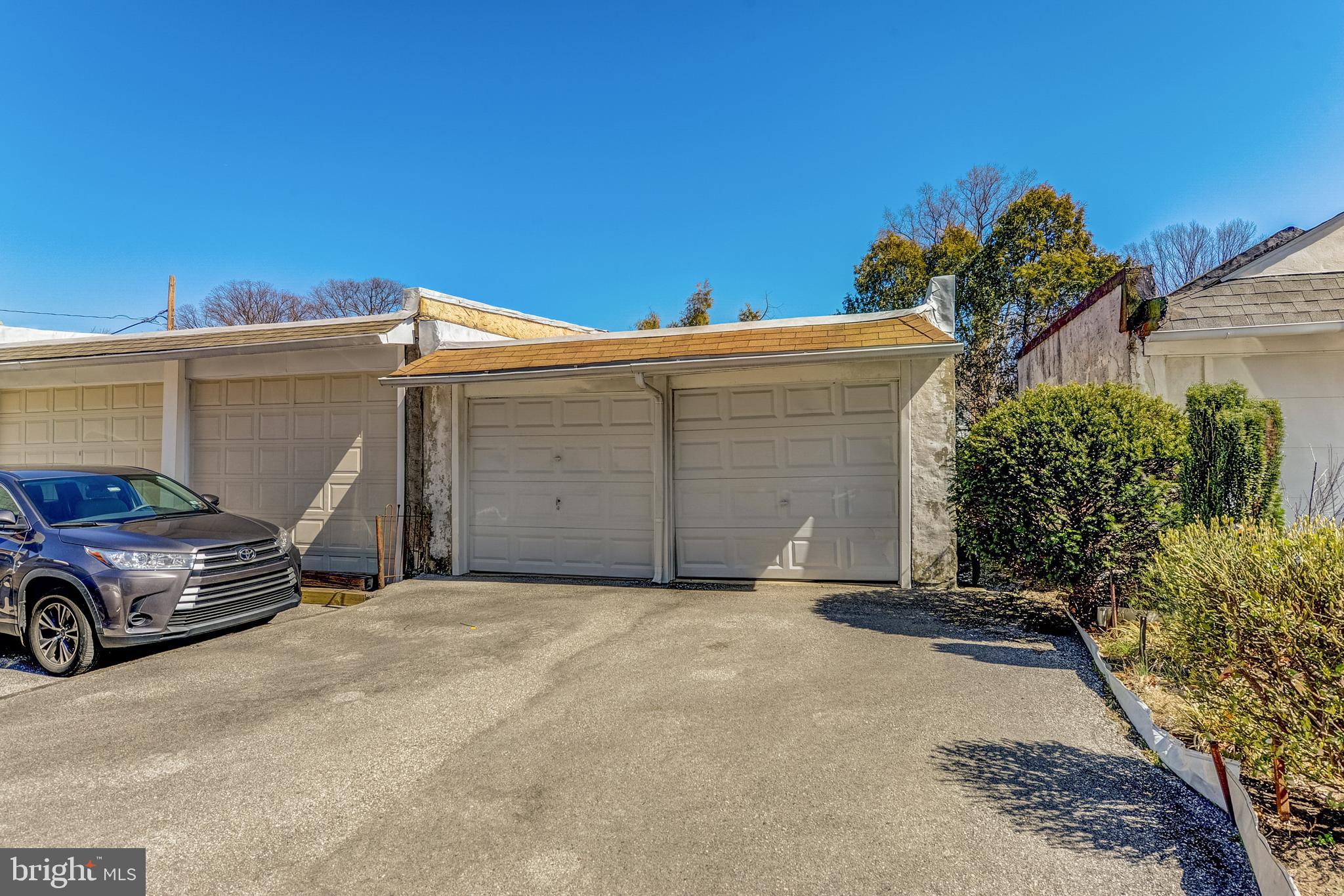 357 East County Line Road Ardmore, PA 19003 - Photo 26 of 27 2 Car garage with large driveway in rear of house