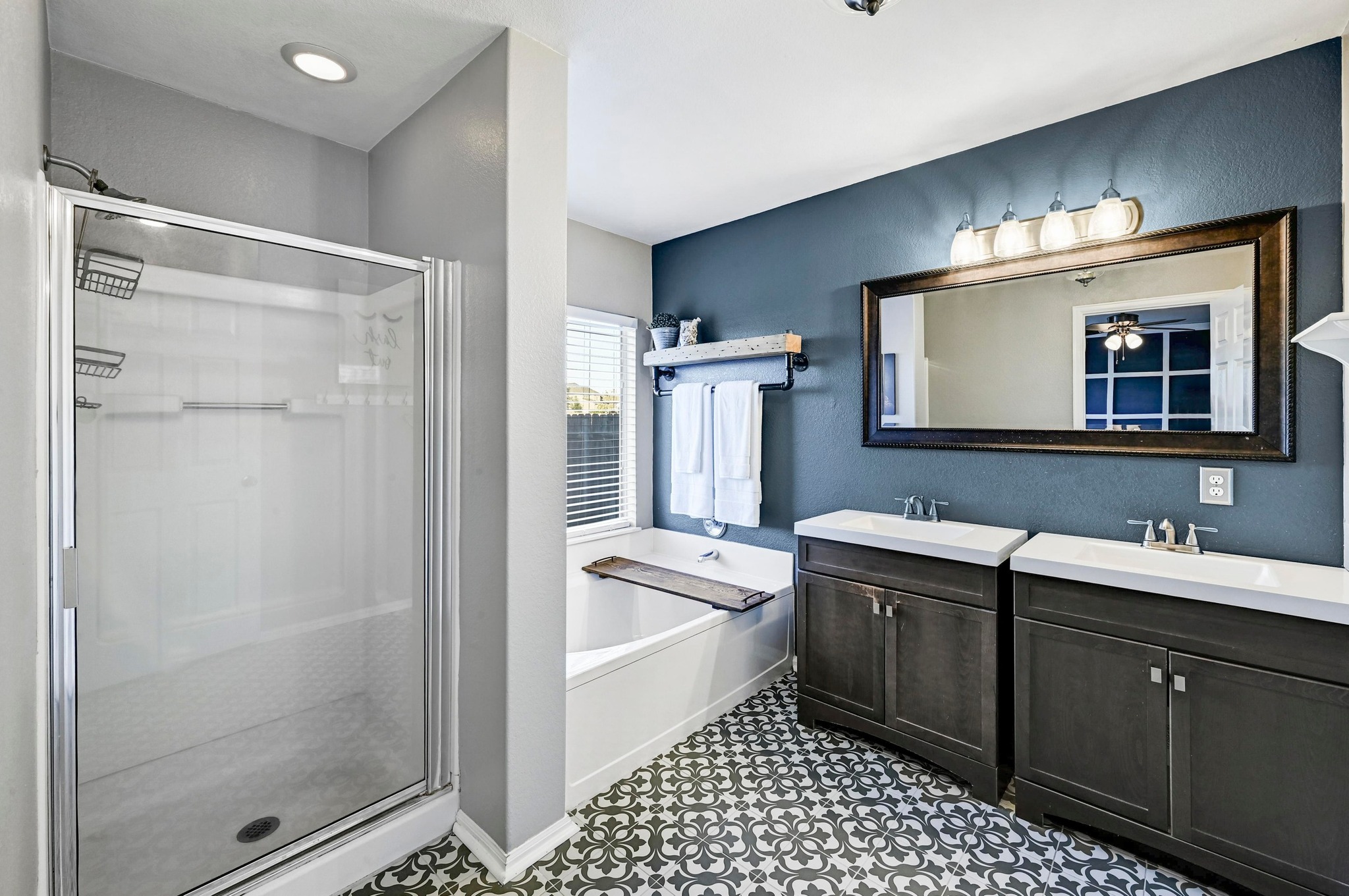280 Spruce Drive Kyle, TX 78640 - Photo 17 of 30 Bathroom featuring a stall shower, vanity, and a bath