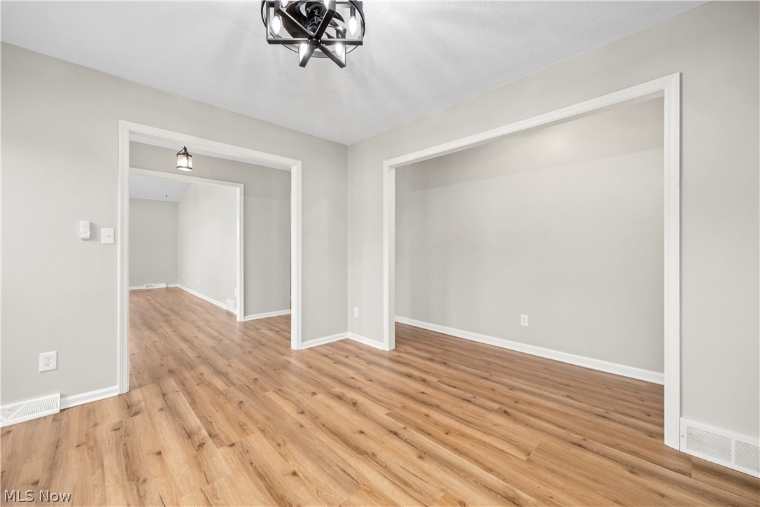 36220 Neff Road Grafton, OH 44044 - Photo 12 of 50 Spare room with light wood-type flooring and suspended lighting