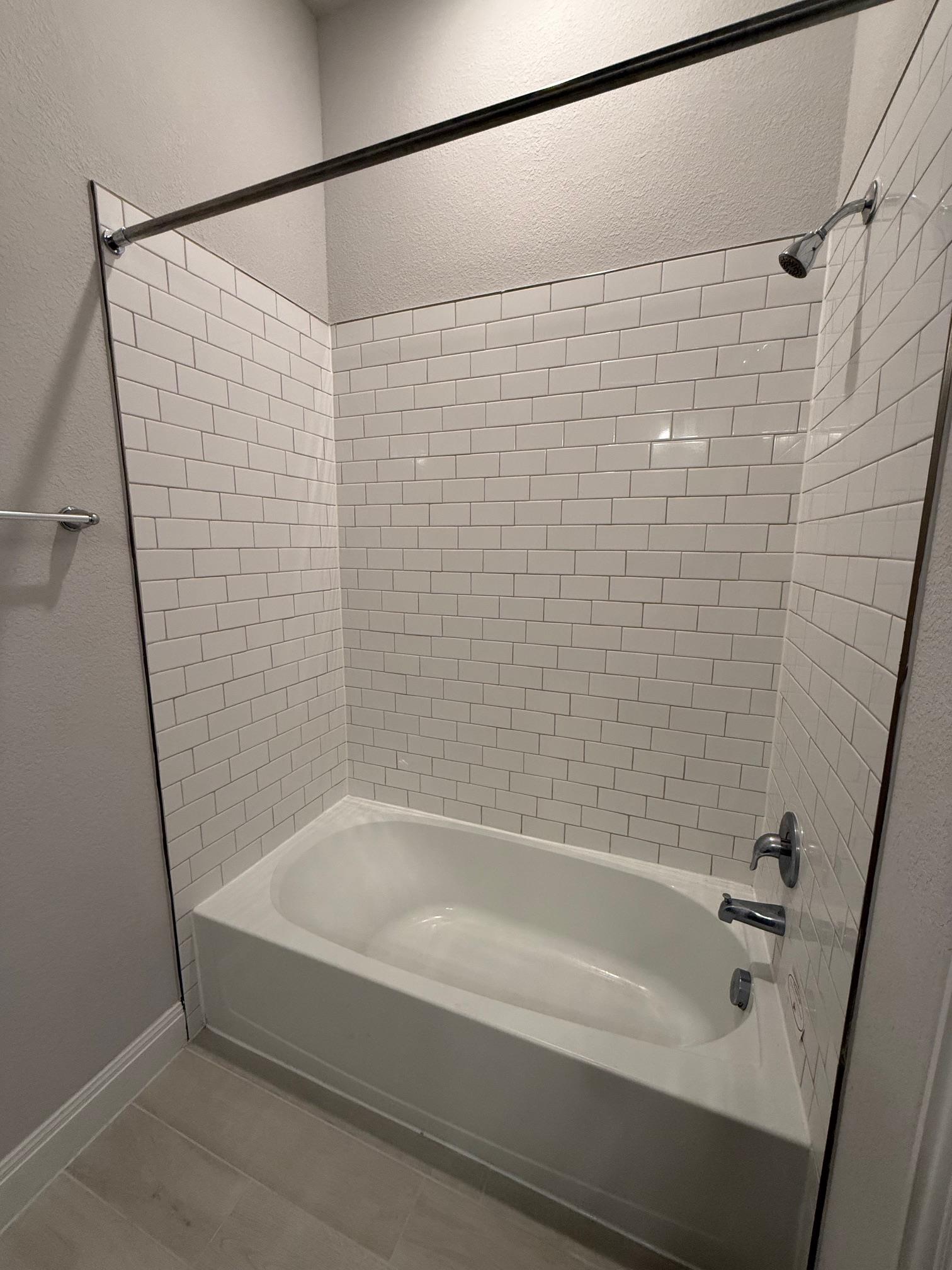 1432 Ridge Runner Drive Georgetown, TX 78628 - Photo 21 of 27 Full bathroom featuring shower / washtub combination and a textured wall