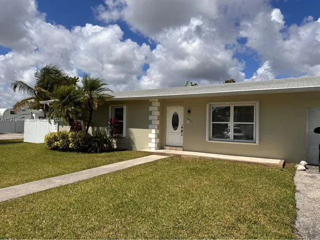 a front view of house with yard