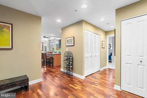 a utility room with furniture and a kitchen view