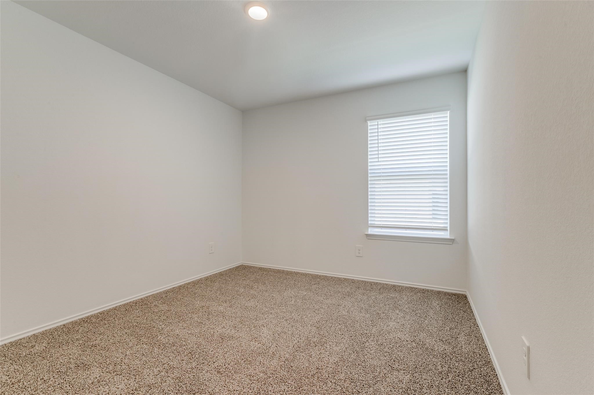 24323 Cayman Heights Lane Spring, TX 77373 - Photo 5 of 12 an empty room with a window