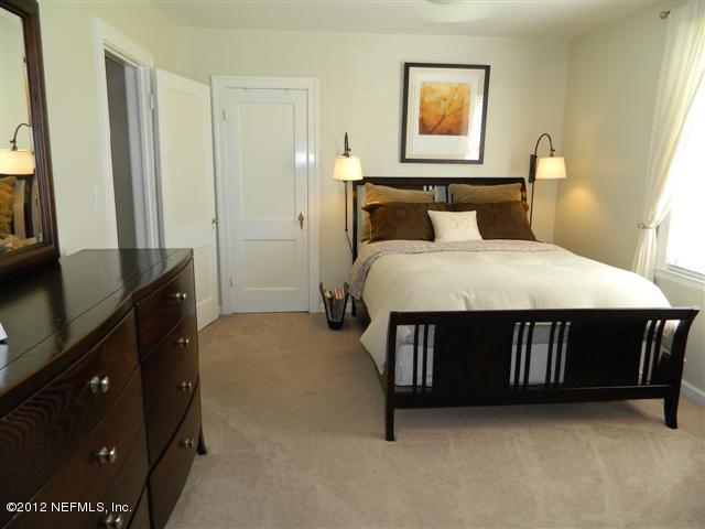 2231 Southampton Road Jacksonville, FL 32207 - Photo 14 of 23 a bedroom with a bed dresser and a window
