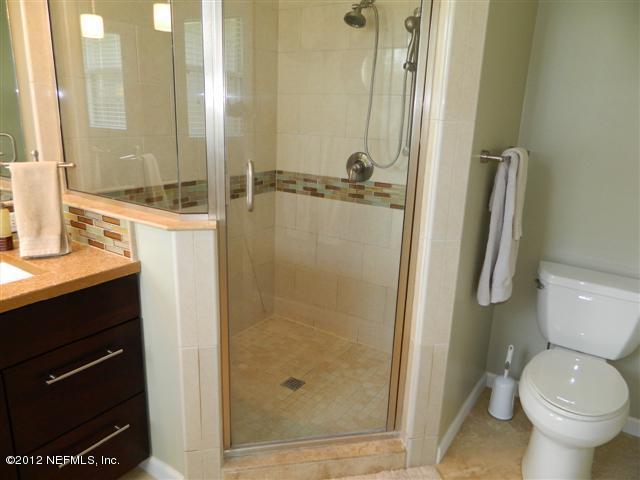 2231 Southampton Road Jacksonville, FL 32207 - Photo 18 of 23 a bathroom with a granite countertop sink toilet and shower