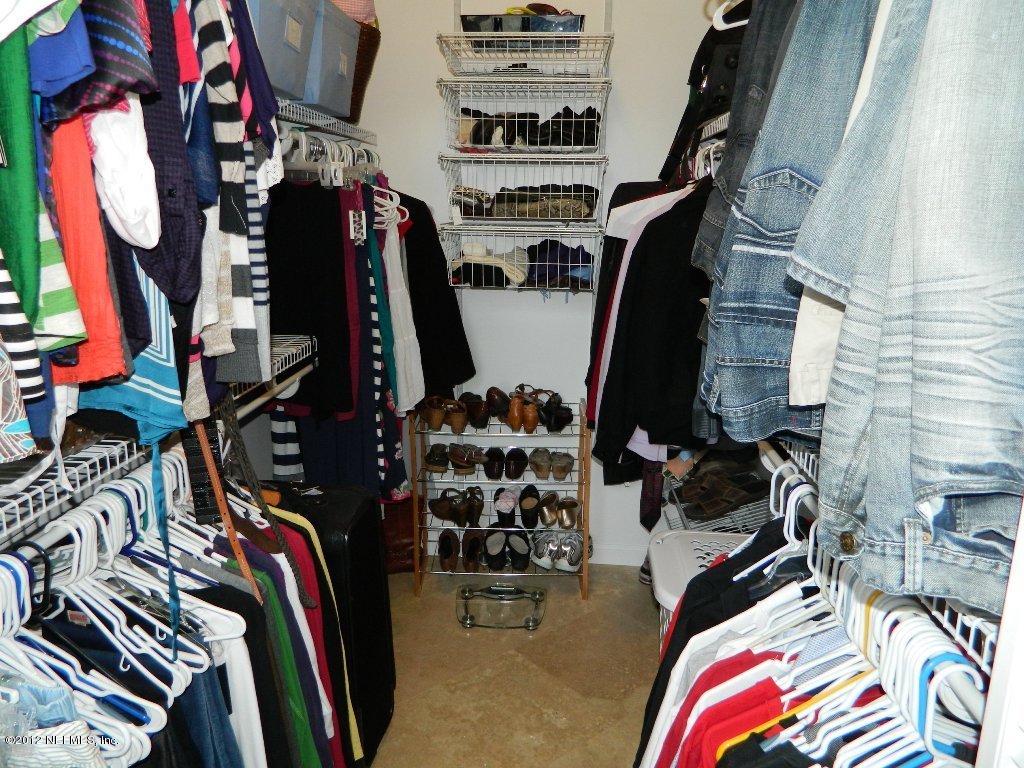 2231 Southampton Road Jacksonville, FL 32207 - Photo 19 of 23 a view of walk in closet with clothes