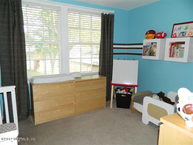 2231 Southampton Road Jacksonville, FL 32207 - Photo 21 of 23 a room with a window and a table chair