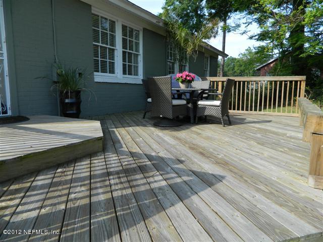 2231 Southampton Road Jacksonville, FL 32207 - Photo 6 of 23 a view of a roof deck with couches and wooden floor