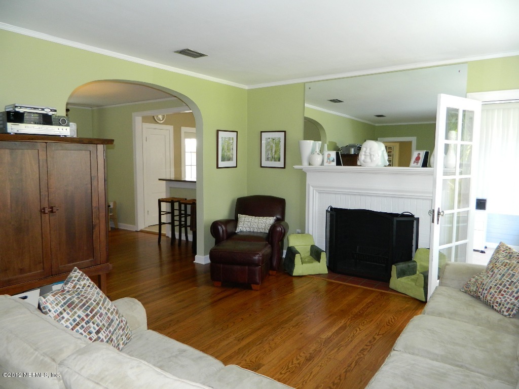 2231 Southampton Road Jacksonville, FL 32207 - Photo 9 of 23 a living room with furniture and a fireplace