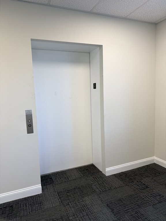 27 Water Street, Unit 401 Wakefield, MA 01880 - Photo 11 of 17 a view of an empty room with wooden floor
