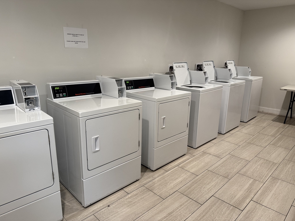 27 Water Street, Unit 401 Wakefield, MA 01880 - Photo 14 of 17 a utility room with dryer and washer