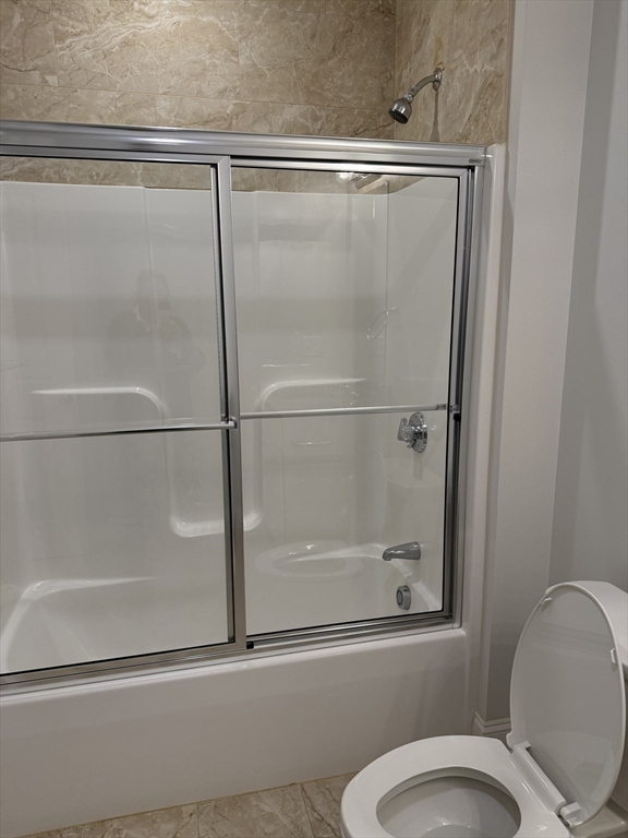 27 Water Street, Unit 401 Wakefield, MA 01880 - Photo 8 of 17 a bathroom with a shower and toilet