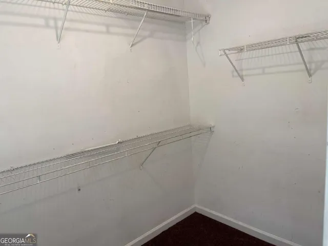 a view of a room with racks on the wall