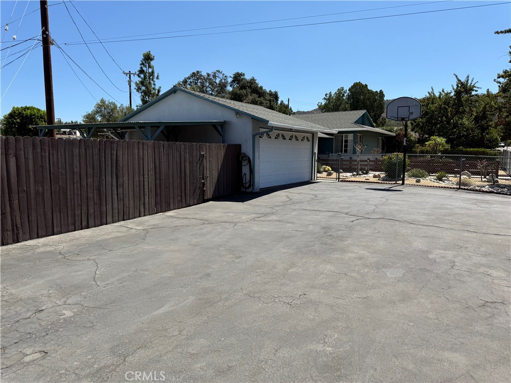 10430 McVine Avenue Sunland, CA 91040 - Photo 12 of 52 a view of a house with wooden fence