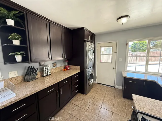 a kitchen with a sink appliances and cabinets