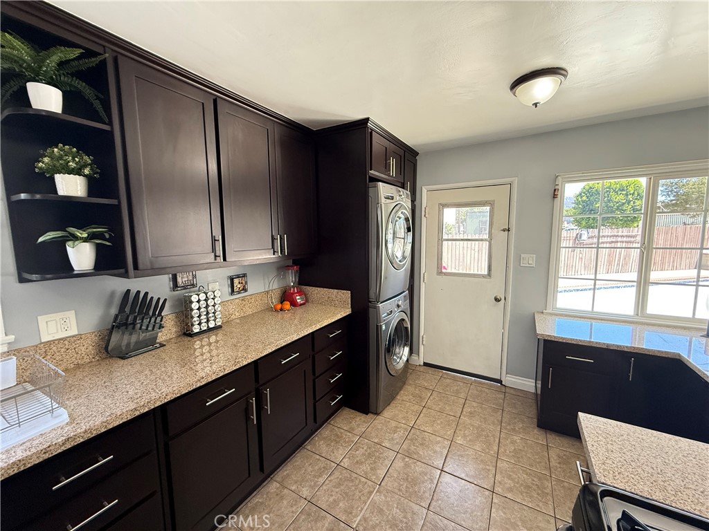 10430 McVine Avenue Sunland, CA 91040 - Photo 24 of 52 a kitchen with granite countertop a refrigerator and a sink