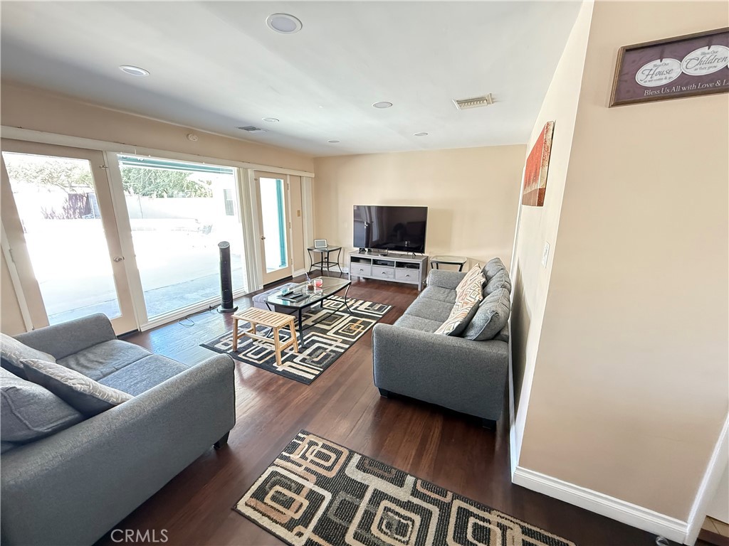 10430 McVine Avenue Sunland, CA 91040 - Photo 30 of 52 a living room with furniture and a flat screen tv