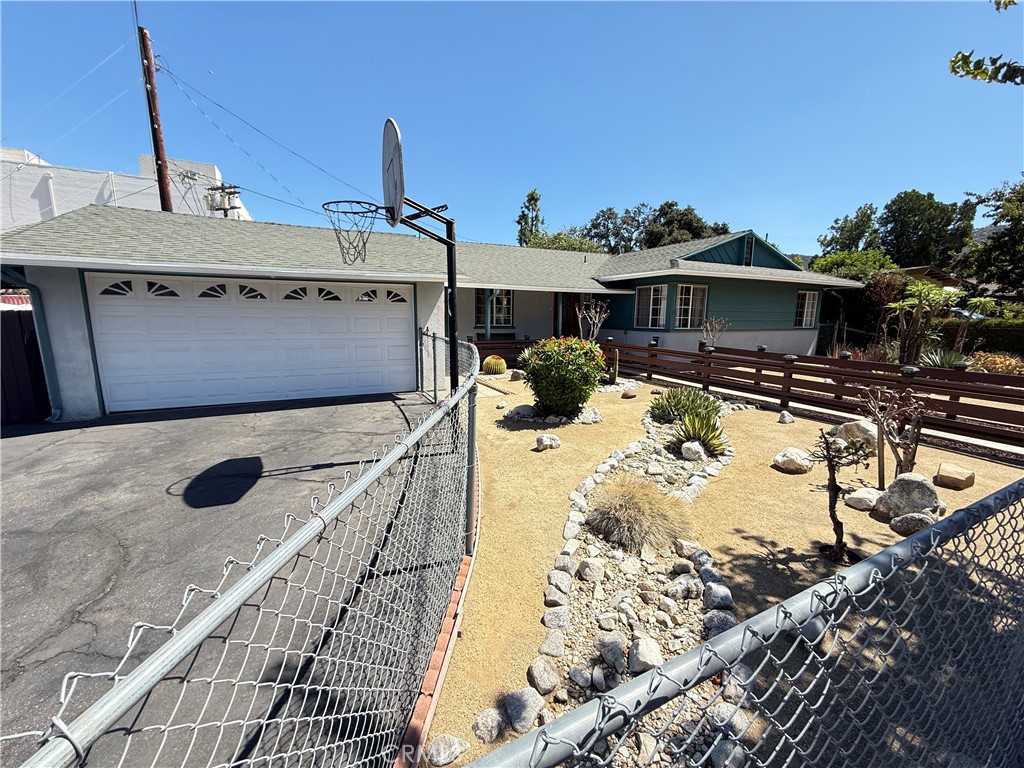 10430 McVine Avenue Sunland, CA 91040 - Photo 3 of 52 a view of a terrace with a wooden fence