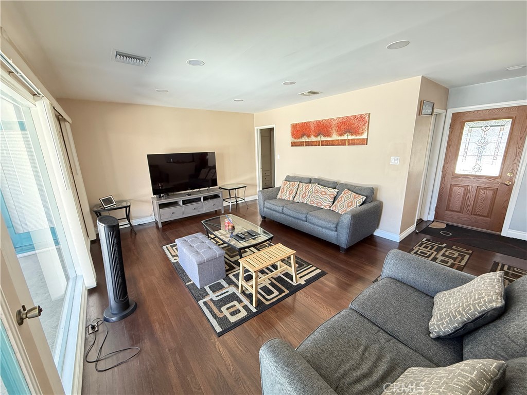 10430 McVine Avenue Sunland, CA 91040 - Photo 32 of 52 a living room with furniture and a flat screen tv