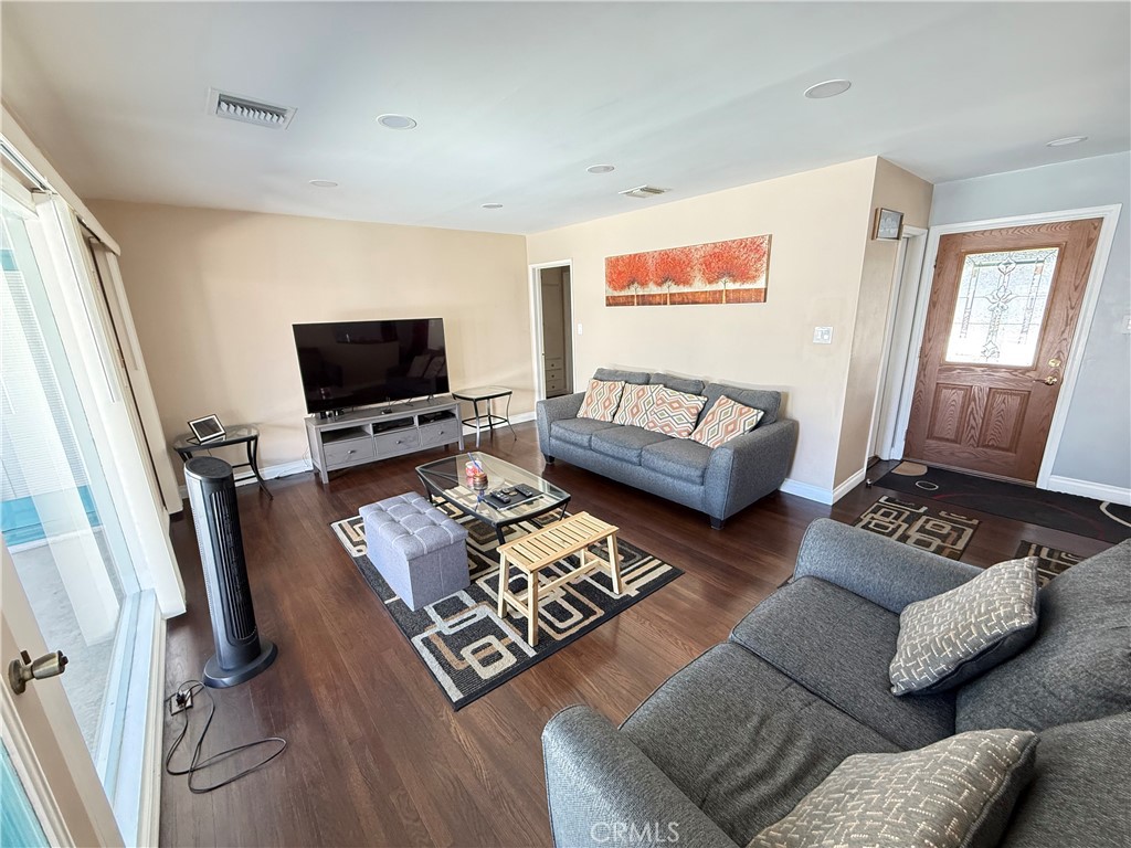 10430 McVine Avenue Sunland, CA 91040 - Photo 33 of 52 a living room with furniture and a flat screen tv