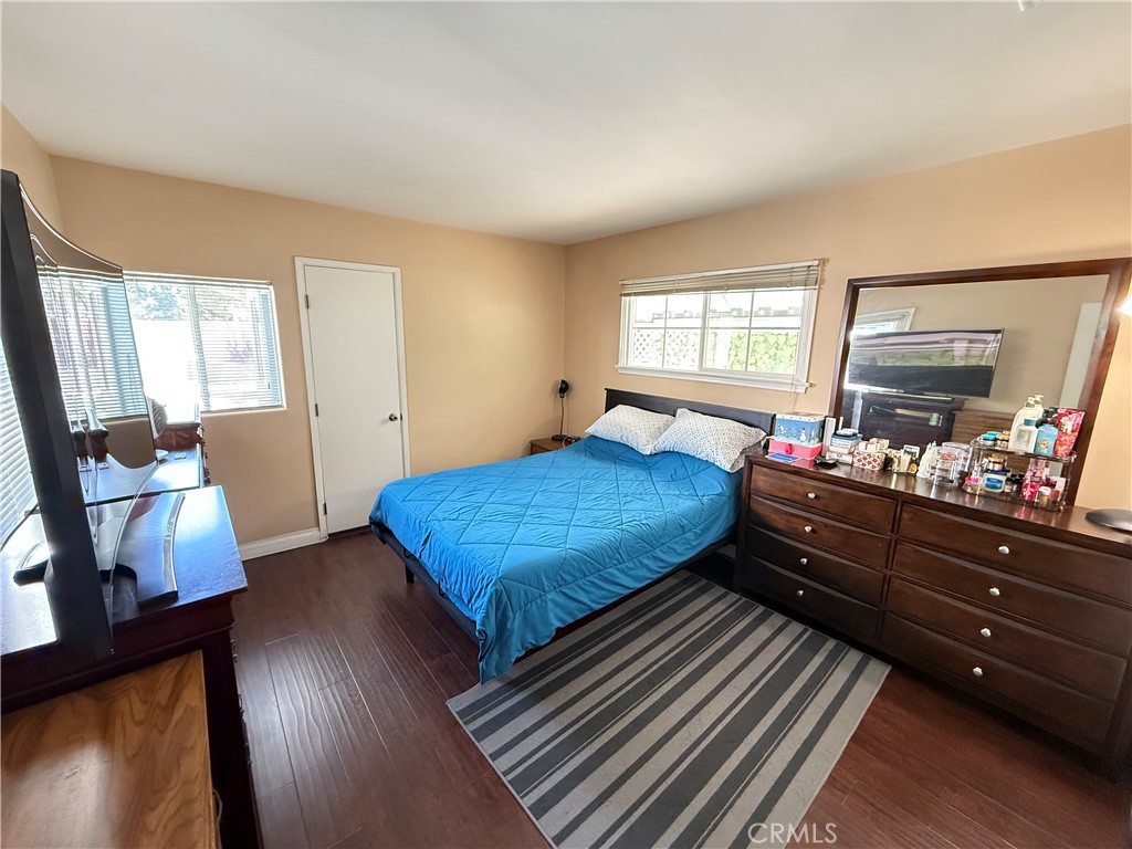 10430 McVine Avenue Sunland, CA 91040 - Photo 35 of 52 a bedroom with a bed and flat screen tv