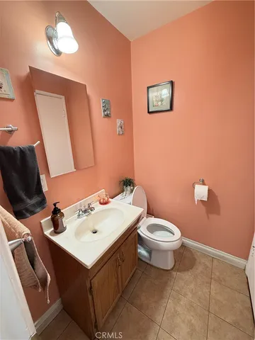a bathroom with a toilet sink and shower