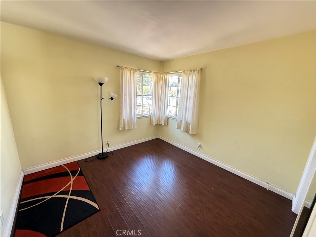 10430 McVine Avenue Sunland, CA 91040 - Photo 46 of 52 a room with wooden floor and windows