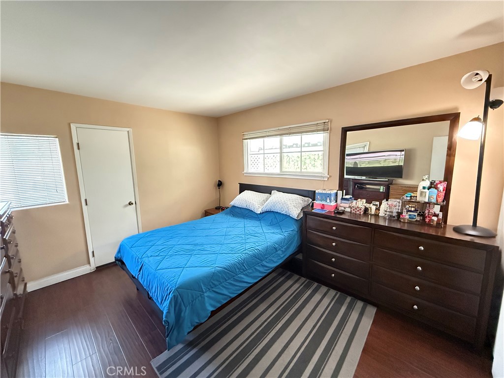 10430 McVine Avenue Sunland, CA 91040 - Photo 47 of 52 a bed room with a bed and a mirror on dresser