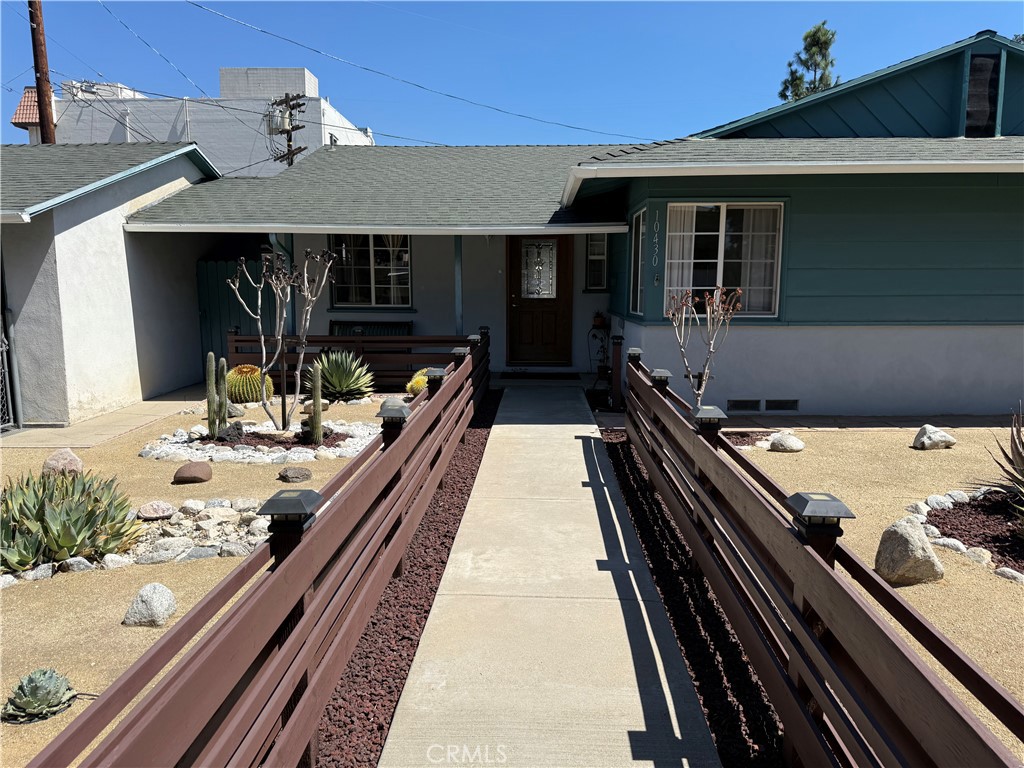 10430 McVine Avenue Sunland, CA 91040 - Photo 6 of 52 a view of a patio with two couches and wooden floor
