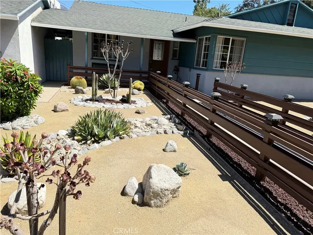 a front view of a house with yard