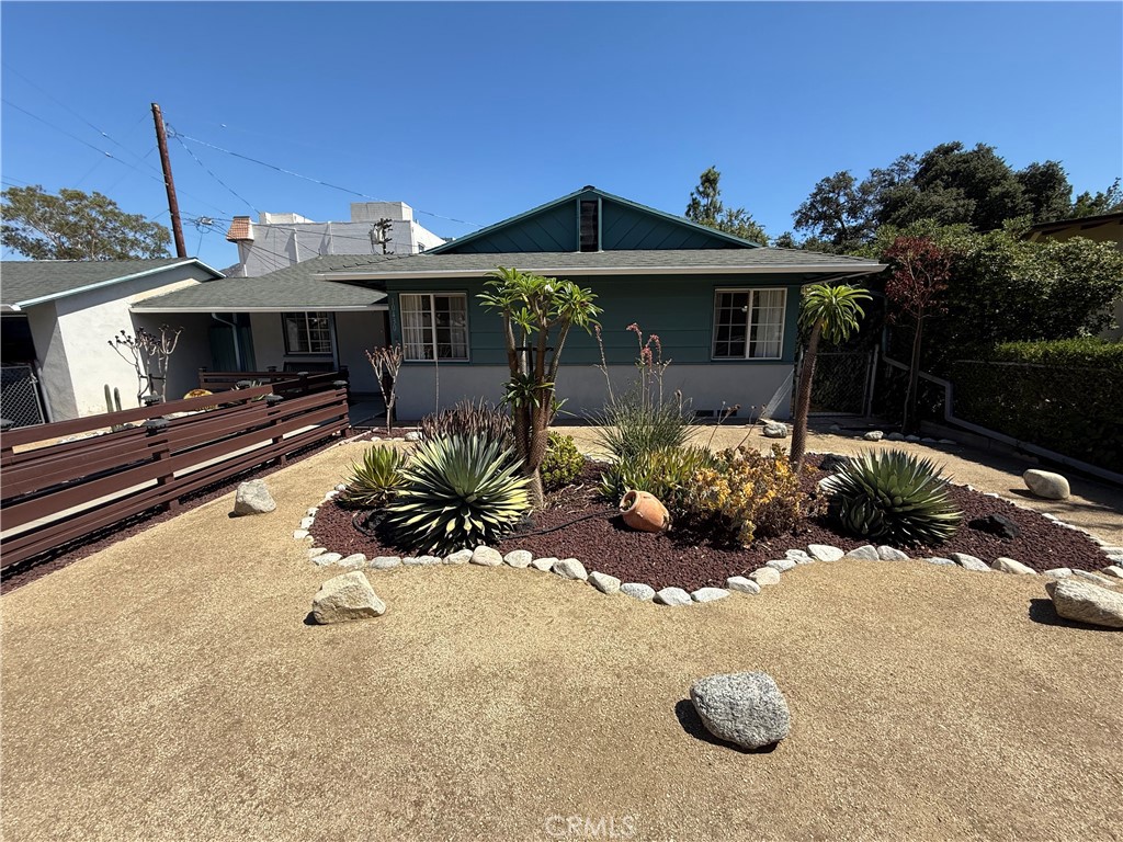 10430 McVine Avenue Sunland, CA 91040 - Photo 8 of 52 a front view of a house with yard