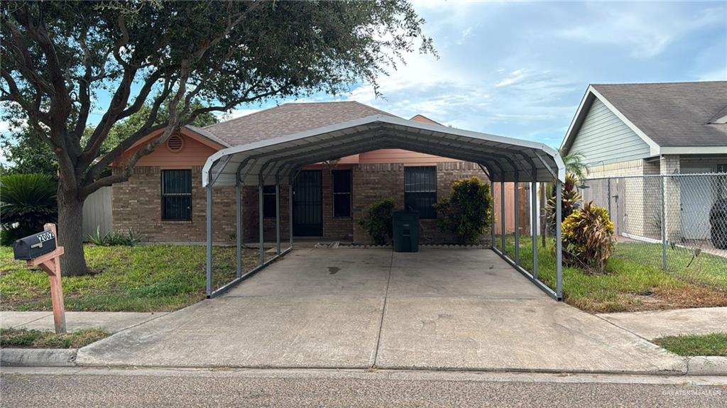 View of front of home featuring a carport