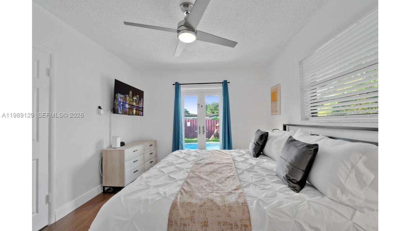 3161 Riverland Road Fort Lauderdale, FL 33312 - Photo 11 of 25 a bedroom with a bed and a window