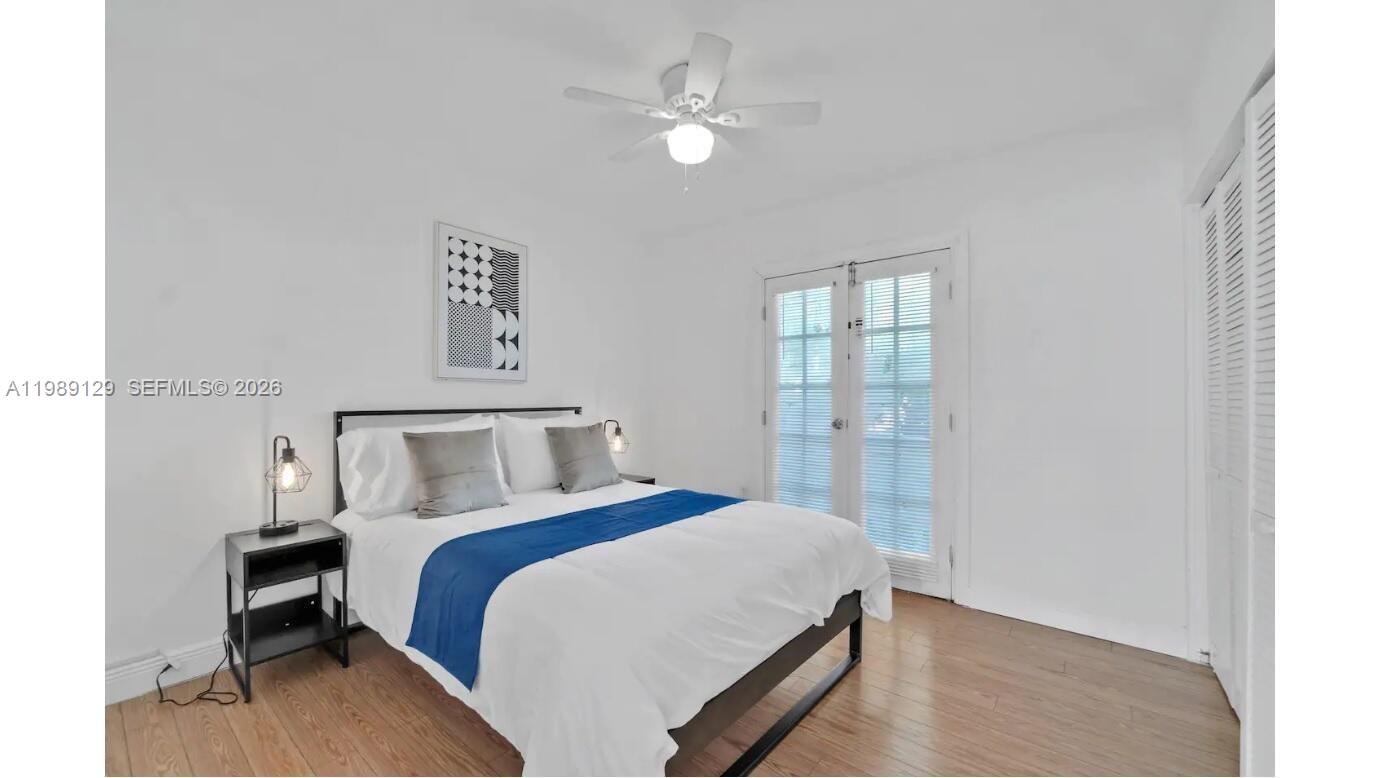 3161 Riverland Road Fort Lauderdale, FL 33312 - Photo 14 of 25 a bed room with a bed and a chandelier