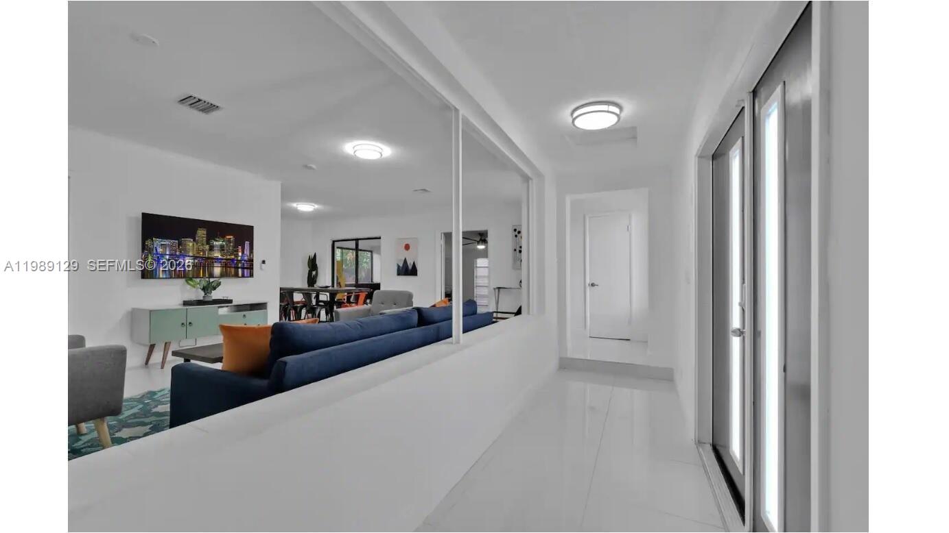 3161 Riverland Road Fort Lauderdale, FL 33312 - Photo 17 of 25 a living room with furniture and a flat screen tv