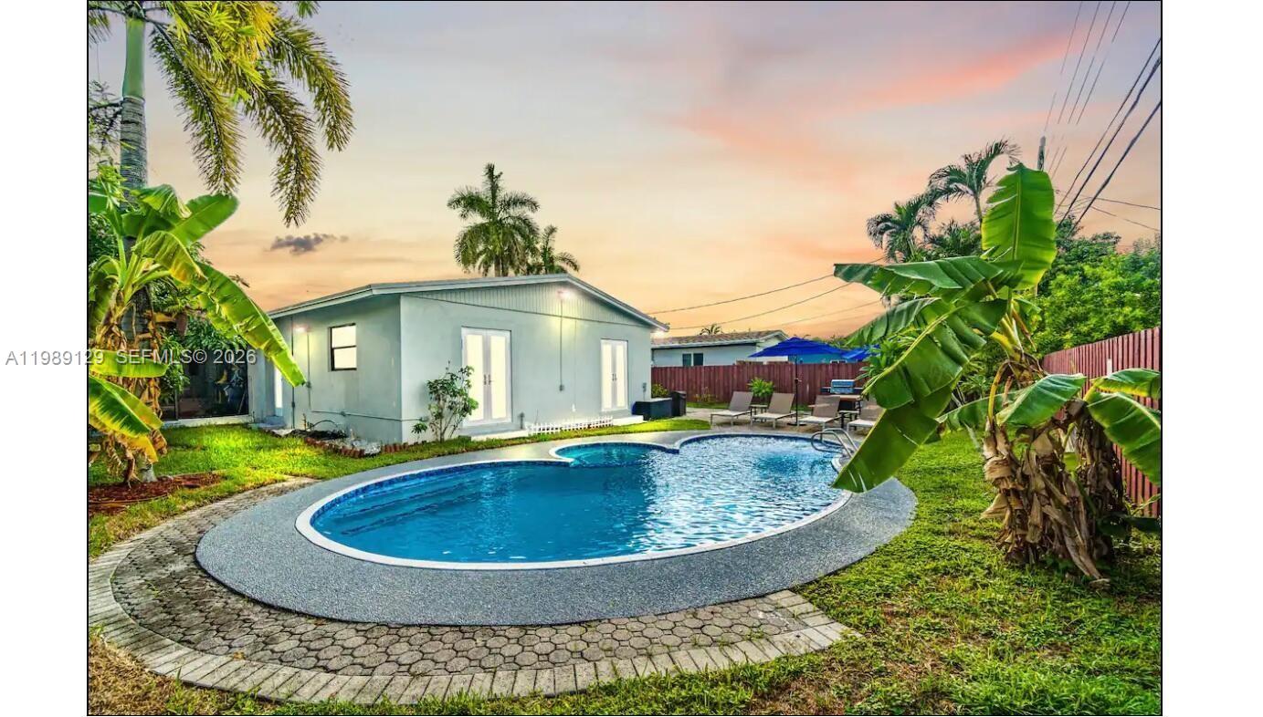 3161 Riverland Road Fort Lauderdale, FL 33312 - Photo 2 of 25 a view of a house with backyard swimming pool and sitting area