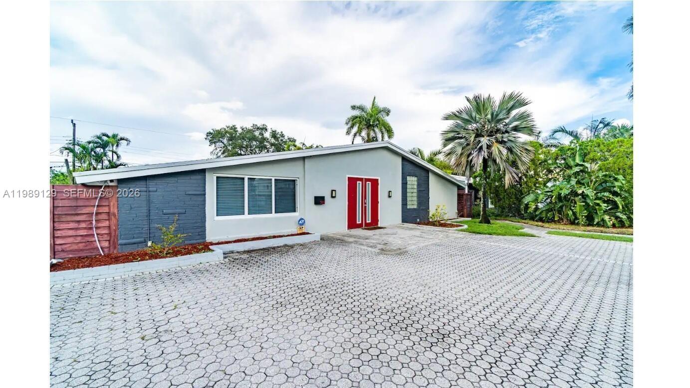 3161 Riverland Road Fort Lauderdale, FL 33312 - Photo 25 of 25 a view of a house with a yard and potted plants