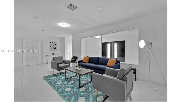 a living room with furniture and a table